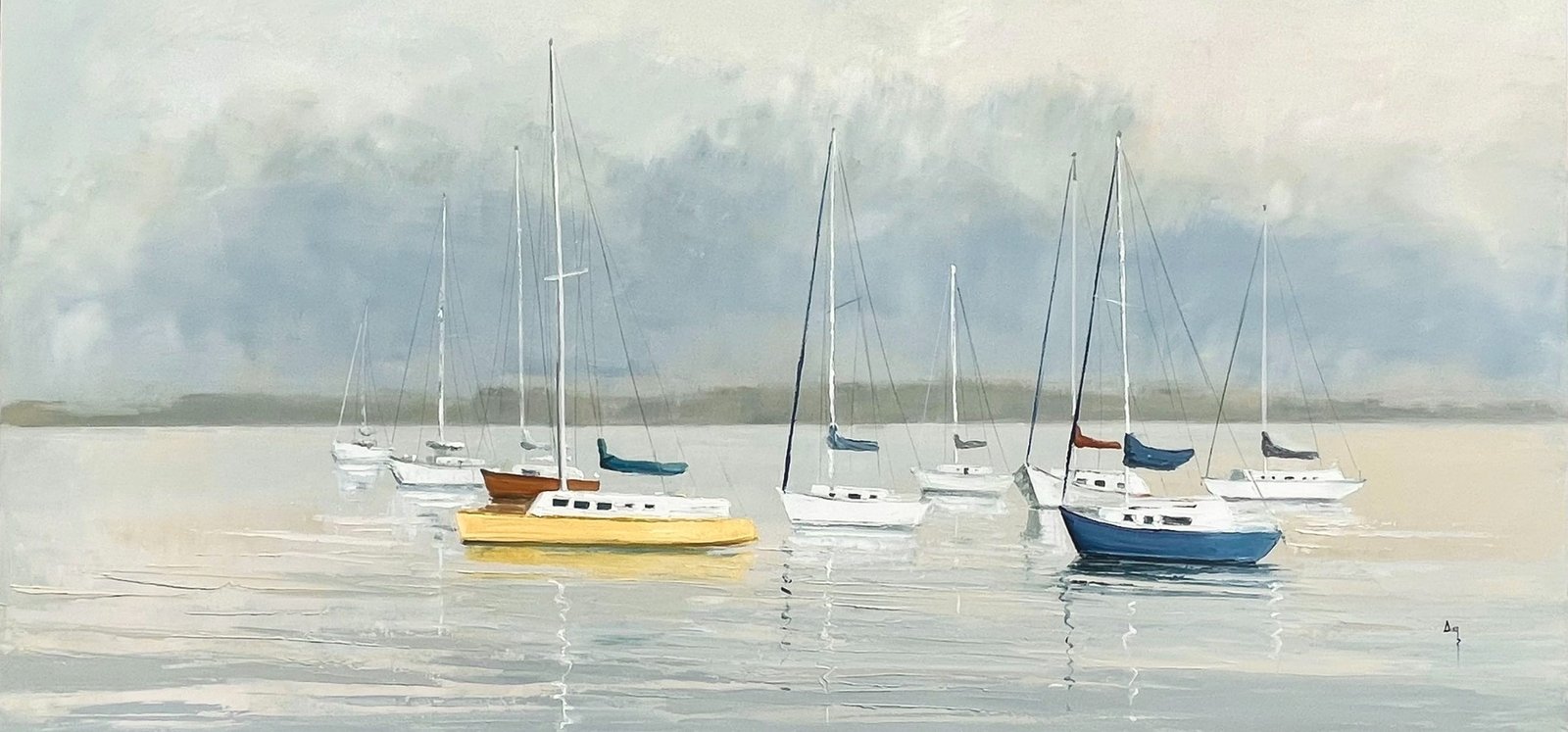 Sailboats at rest on calm coastal water